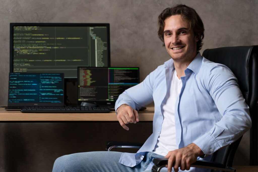 Smiling man working with code